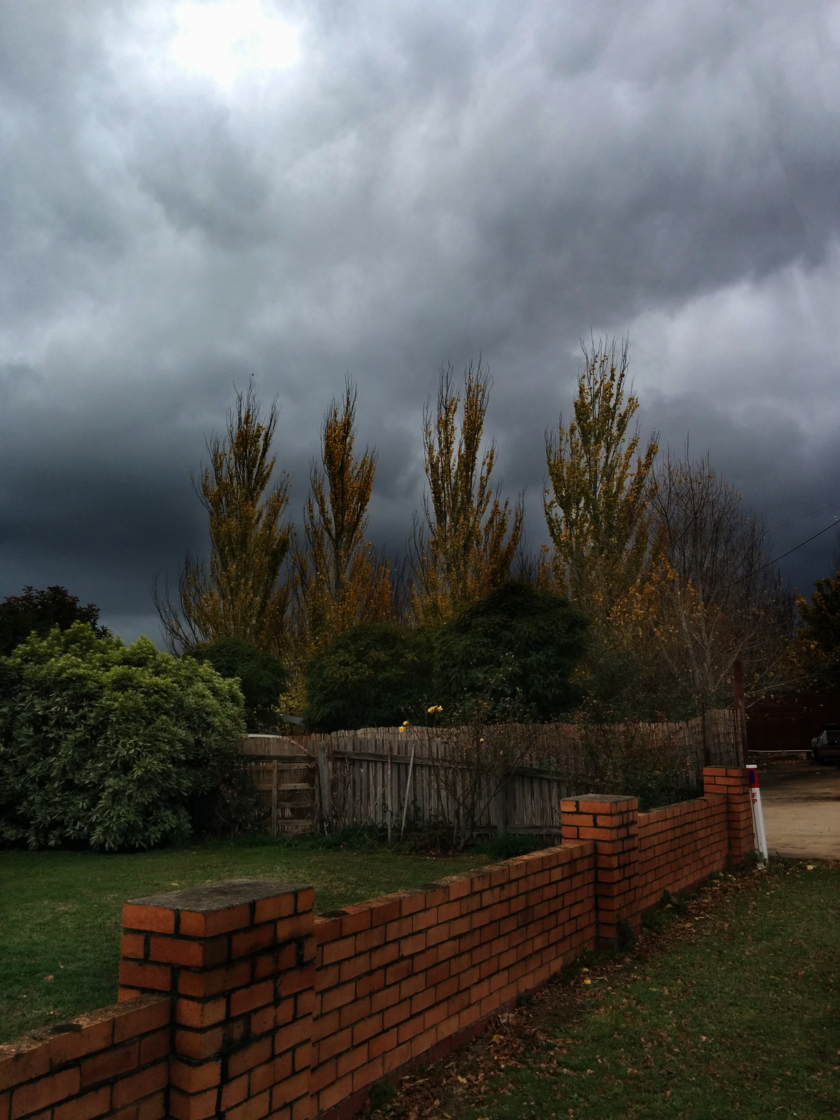 Dark clouds over driveway