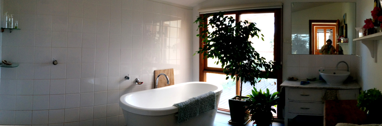 I was in love with the bathroom. There was a rainfall shower next to the tub, with the floor gently sloping inward to the drain. I would have lived in the bathroom alone.